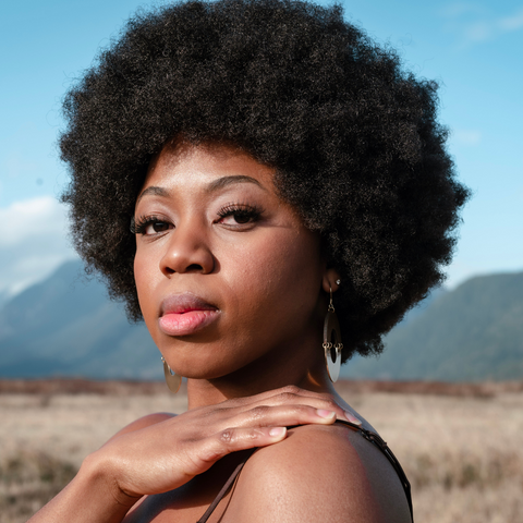 Woman with coily afro hair