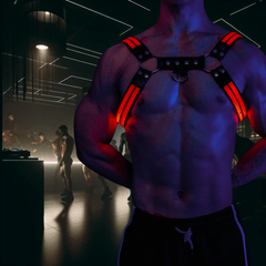 man-wearing-glow-led-gay-harness-nightclub