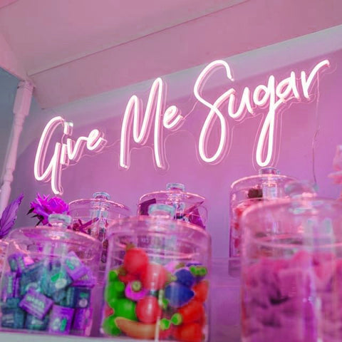 the image shows a pink neon sign