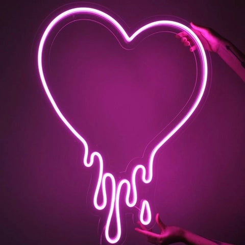 image have a pink melting neon heart sign