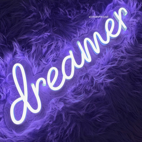 image showing a neon sign of dreamer in purple colour