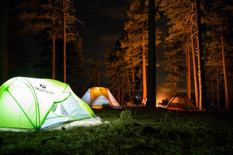 well-lit tents at night