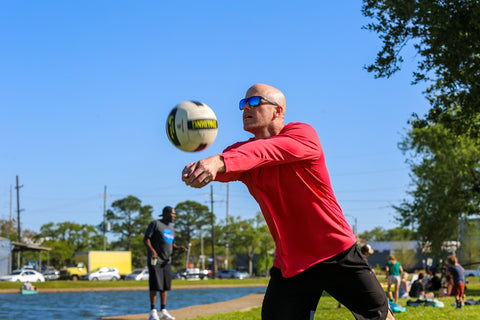 Man Playing Volleyball With Red Polyester Sun Shirt