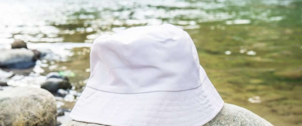 bucket hat by the river