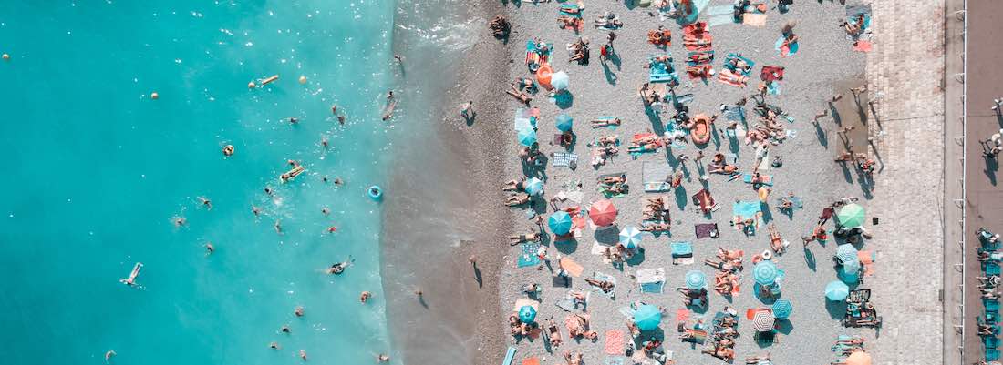 Crowded Beach Needing Sun Protection