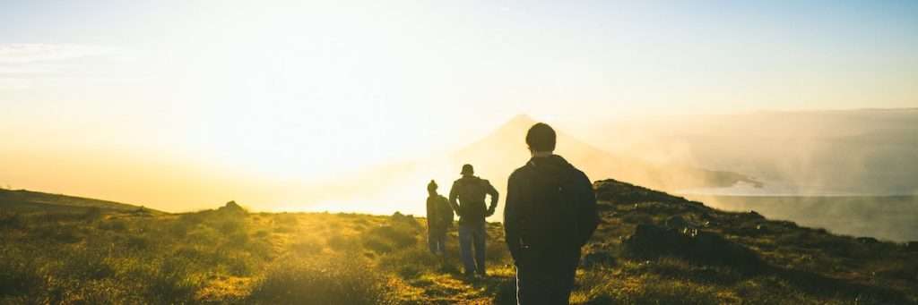 Hikers at sunrise with UV protection apparel