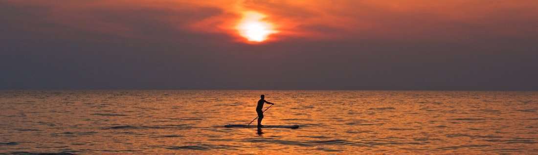 Sunset Paddleboarding with UPF Apparel