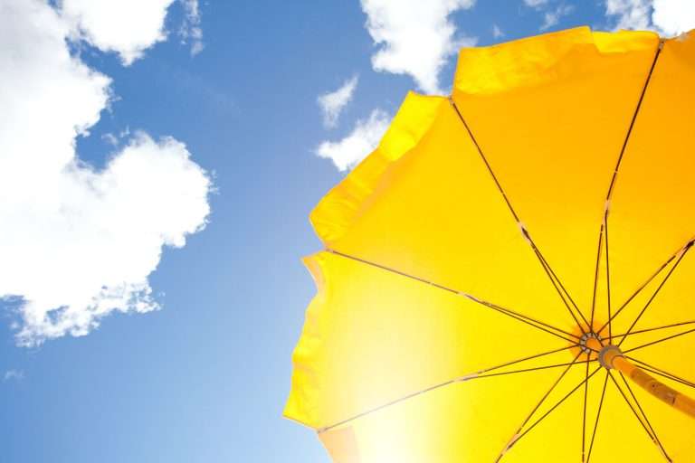 yellow umbrella under the sun