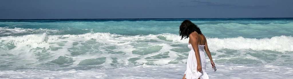 Woman Needs a UPF Hat on the Beach