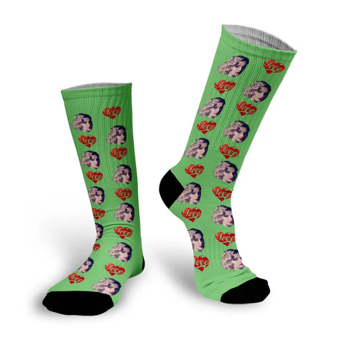 Cushy-Footsie-Footsies-with-Faces-Example-Lady-Face-with Love-Hearts-on-Green-Socks