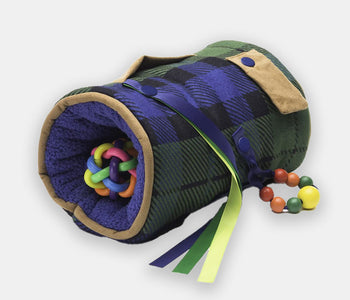 The Twiddle sport sensory sleeve for people living with dementia, with a green and blue tweed pattern.