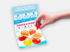 The 6-flavors hydrating Jelly Drops sample pack, with a hand holding a pink-colored drop.