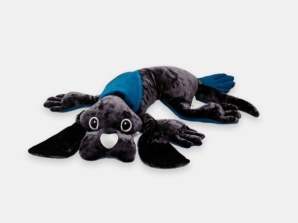 The Manimo grey weighted plush dog: grey on top and blue underneath.