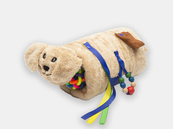 The cream puppy Twiddle sensory sleeve for people living with dementia with fidgety hands.