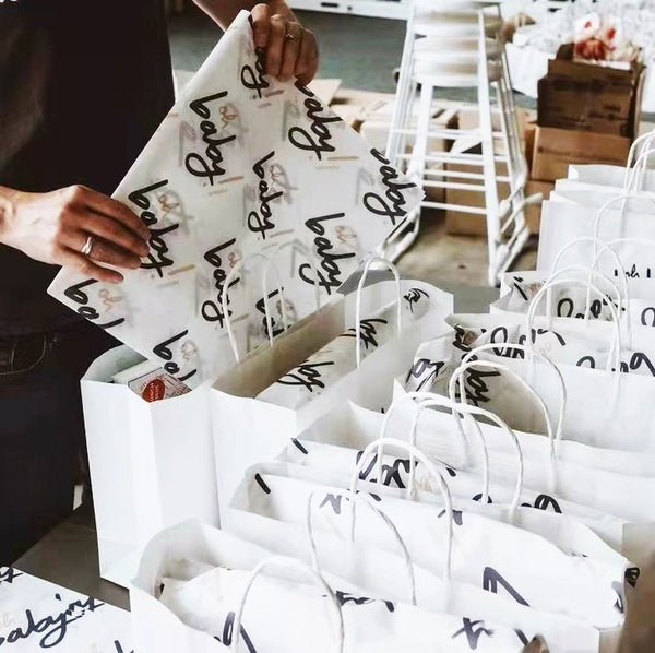 packaging products using custom tissue paper