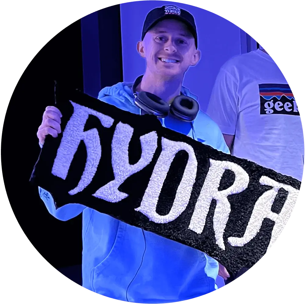 Photo of Josh Johnston holding a custom Hydra rug