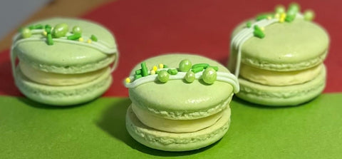 light green macarons with green embellishment candy