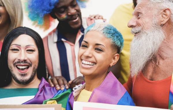 Three LGBTQ people celebtrating LGBTQ Pride