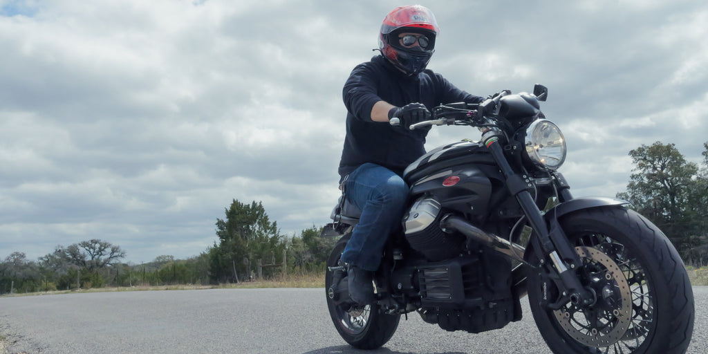 Jake riding on the back roads of the Texas hill country on his Moto Guzzi