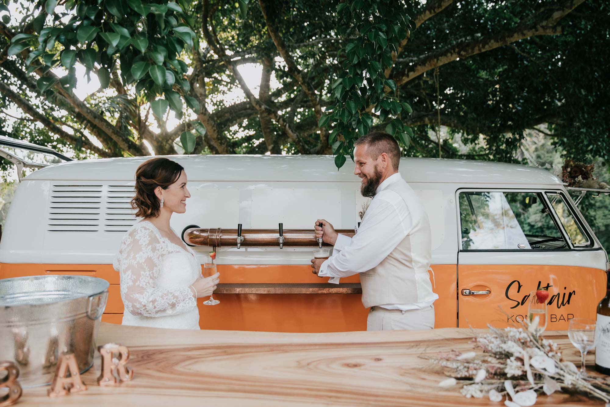 kombi bar Brisbane with beer taps, bride and groom standing behind beer barrels