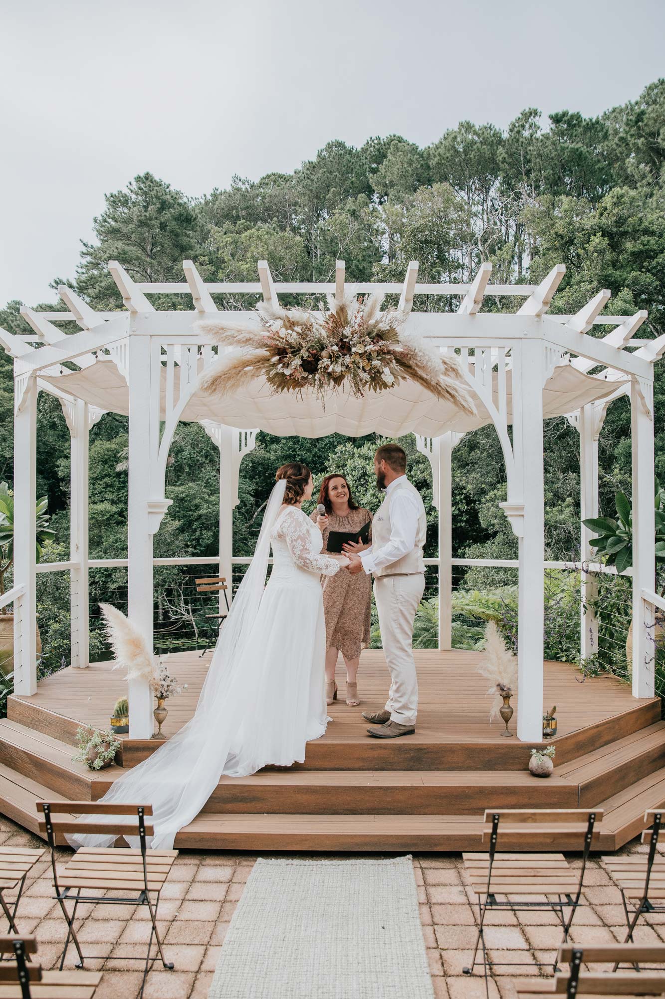 White arbour on a plinth overlooking the lake at Montvale weddings in Maleny