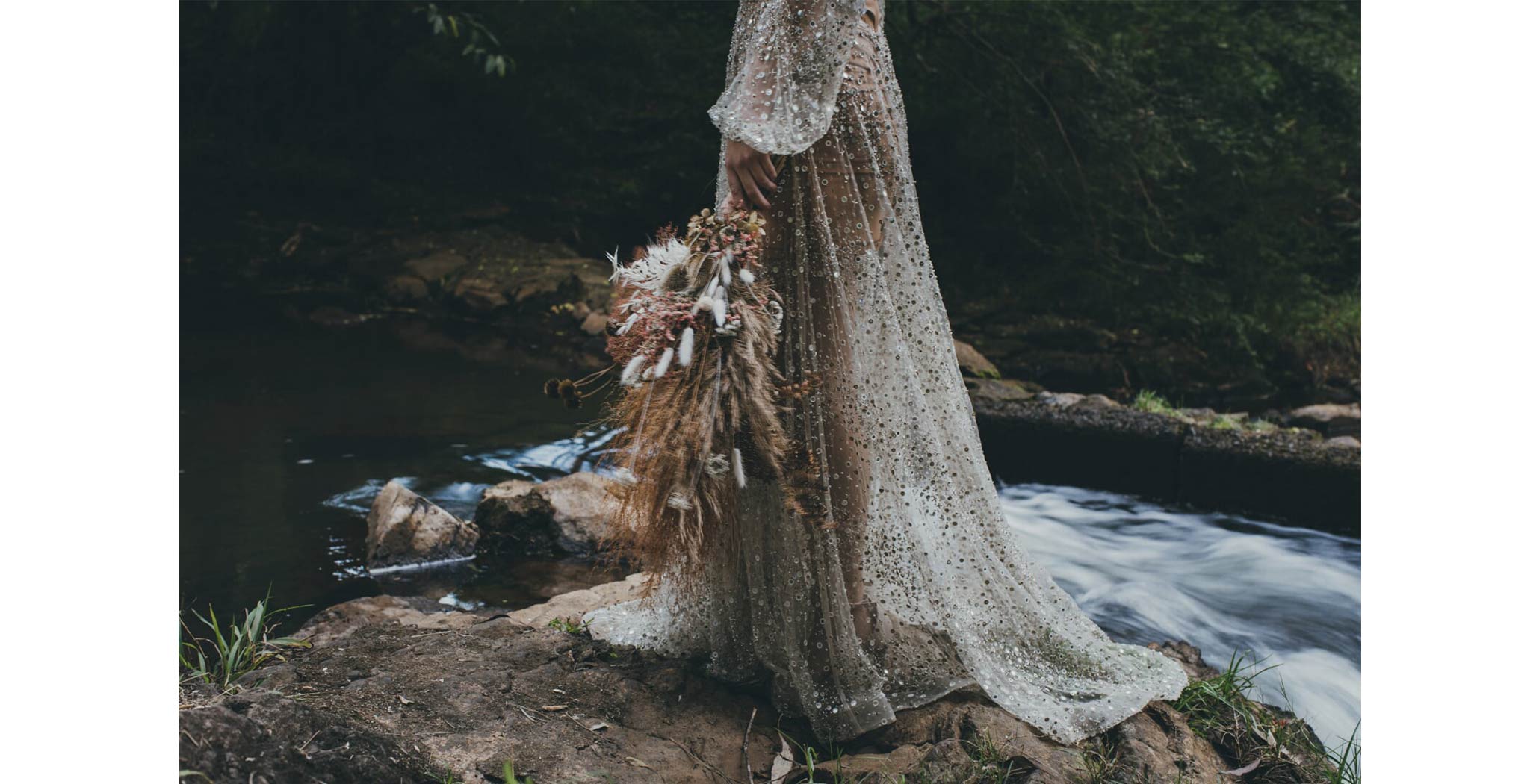 bride with a waterfall backdrop, boho vibes