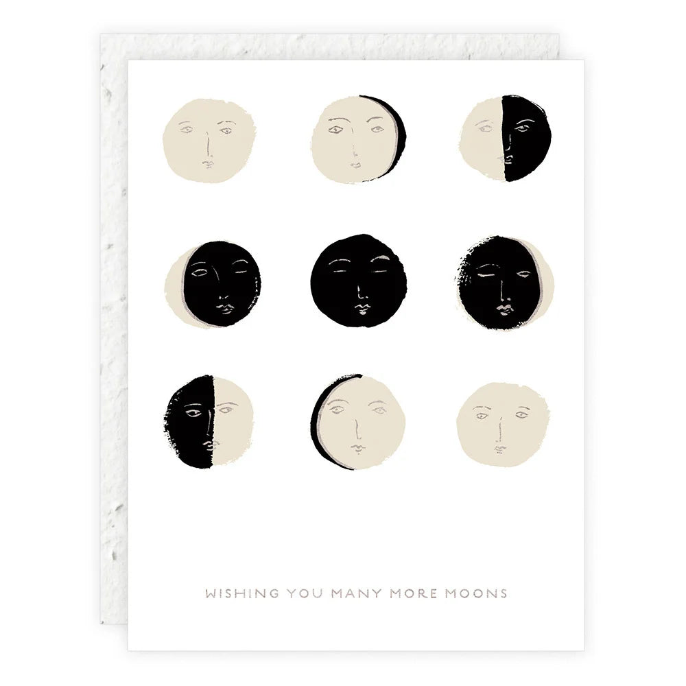 birthday card featuring varying phases of the moon and message "wishing you many more moons"