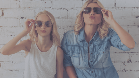 image of woman and daughter posing with sunglasses