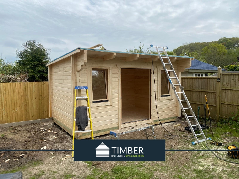 Installing EPDM rubber roofing on Guildford log cabin