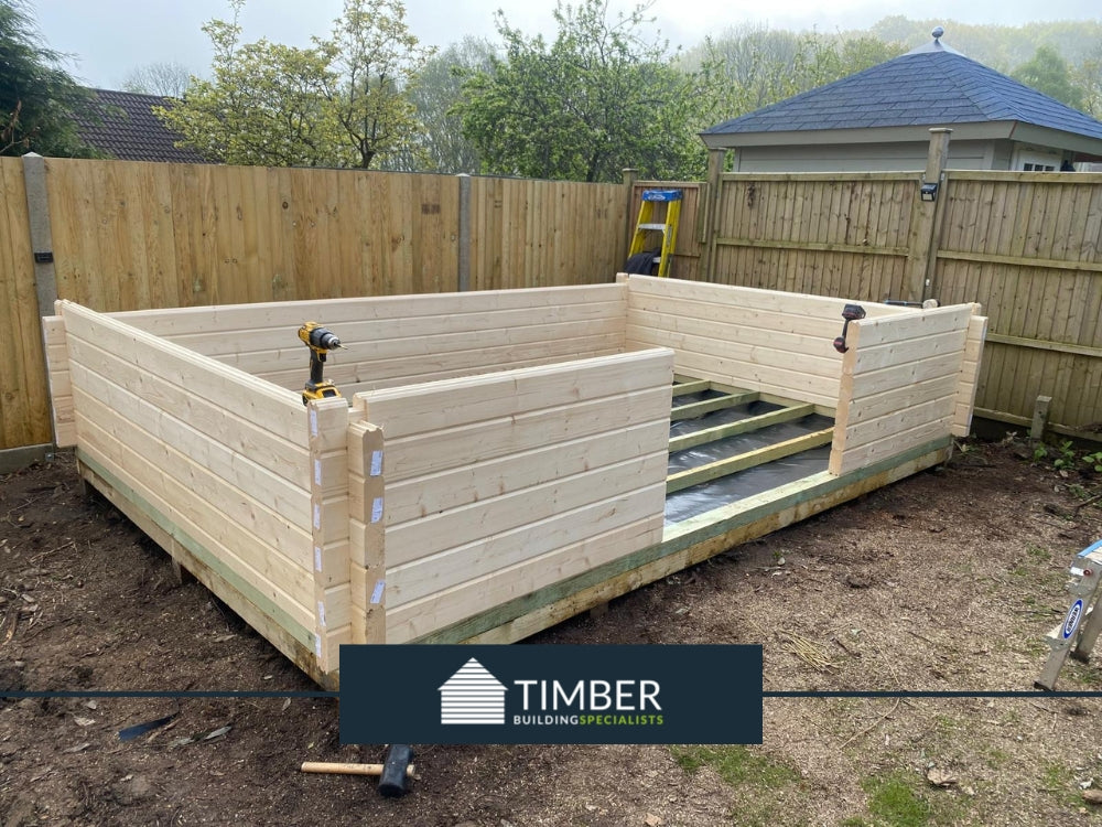 Mid-construction view showing the structural details of log cabin