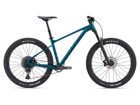 trek roscoe 7 vs giant fathom 2