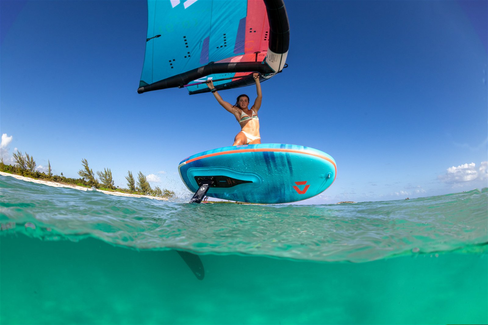 "Inflated Duotone Sky Air Wingsurf Board on clear waters, illustrating early take-off capabilities."