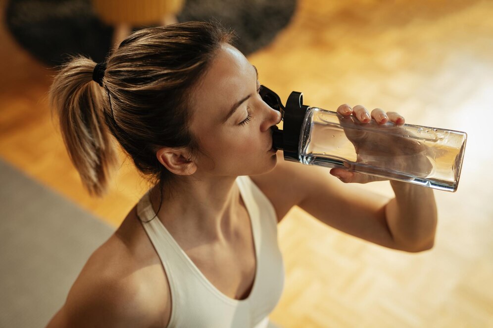 woman drink bottle of water