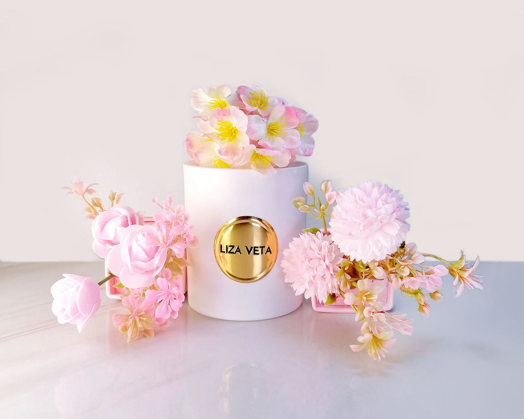 White candle with pink flowers