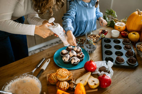 mother and daughter are baking for autumn dinner