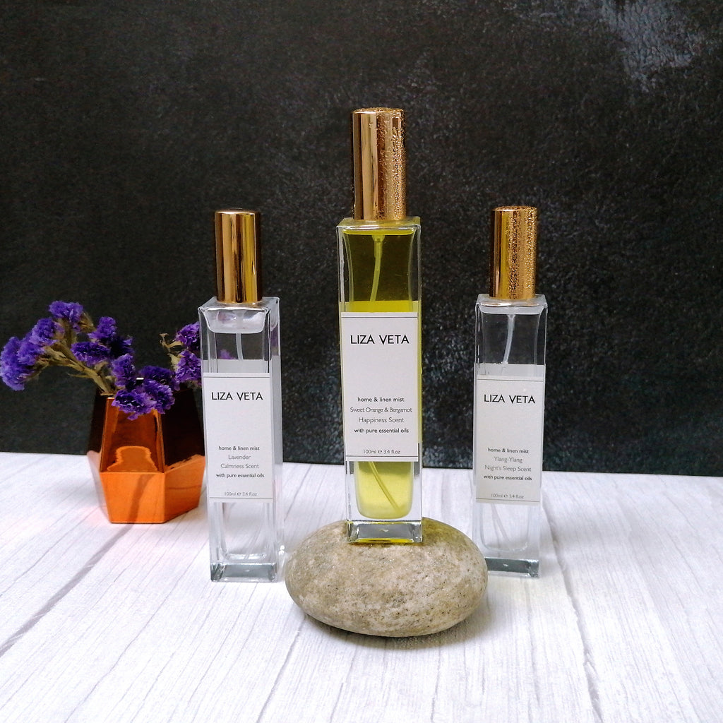 These are three home and linen sprays in a clear square bottles with gold lids. The image is related to home fragrances and how to take care of yourself during spring.