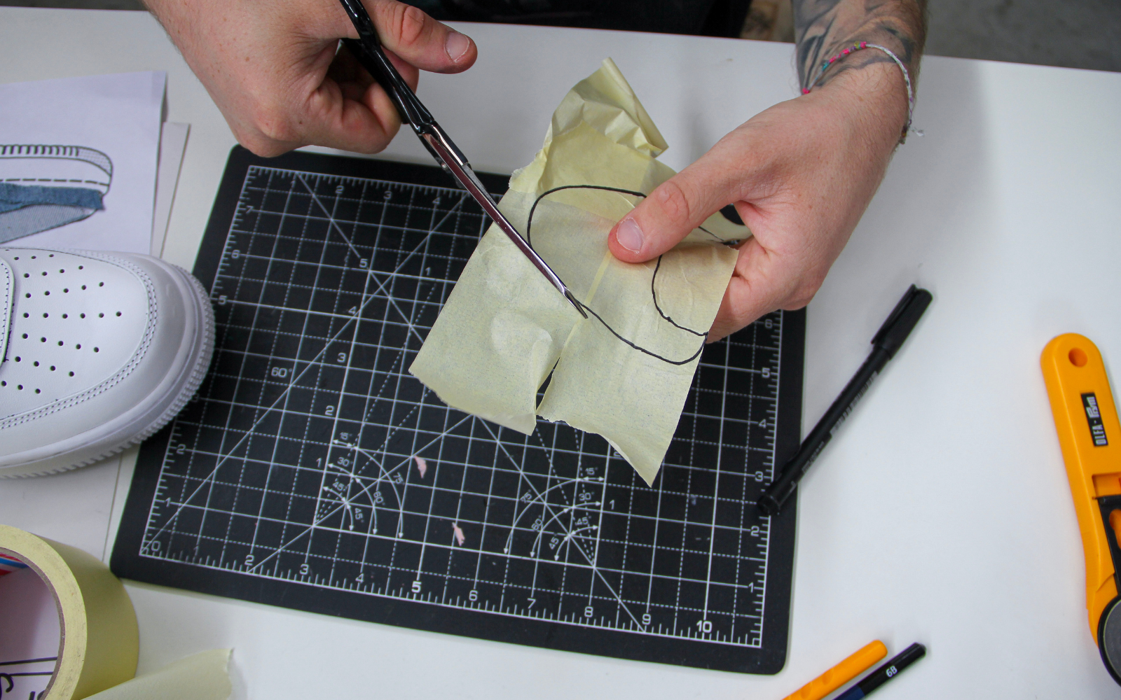 Peel off your scotch tape pattern and now cut with scissors following the line you drew