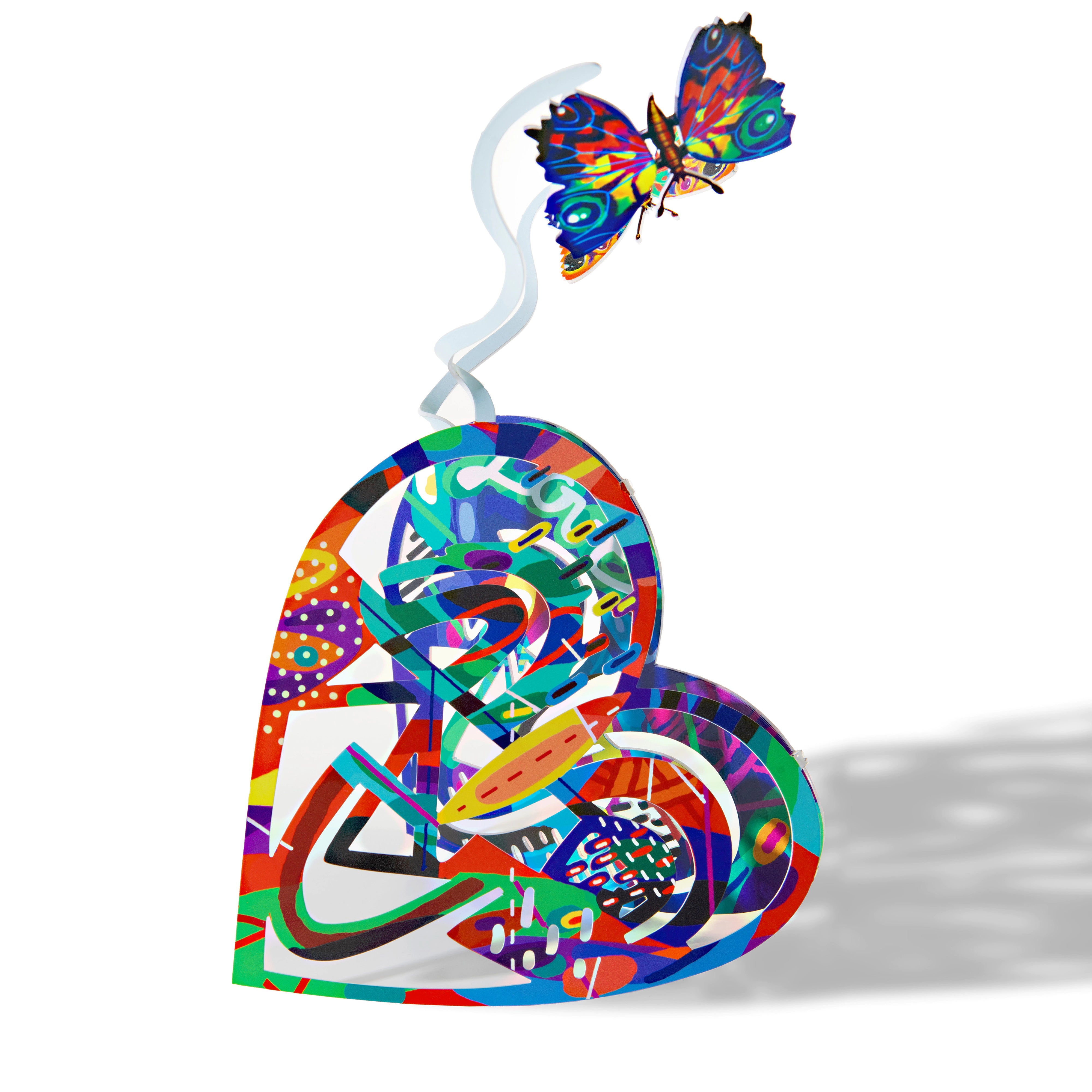 sculpture of a heart with butterflies fluttering above