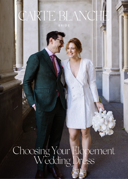 woman wears short wedding dress for elopement wedding with gucci shoes and white bouquet