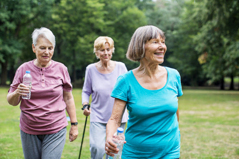 Outdoor shot of senior women walking in park to get fit and have fun