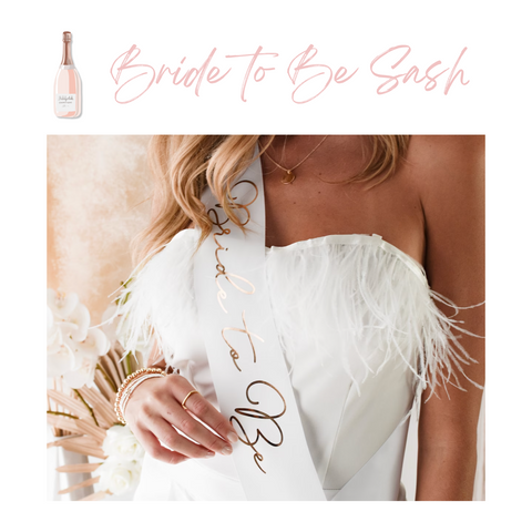 bride to be wearing a white sash on her bachelorette party