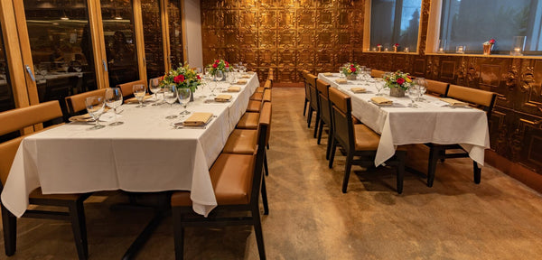 Two rows of tables in the Miami, FL "Yountville Room" private dining space
