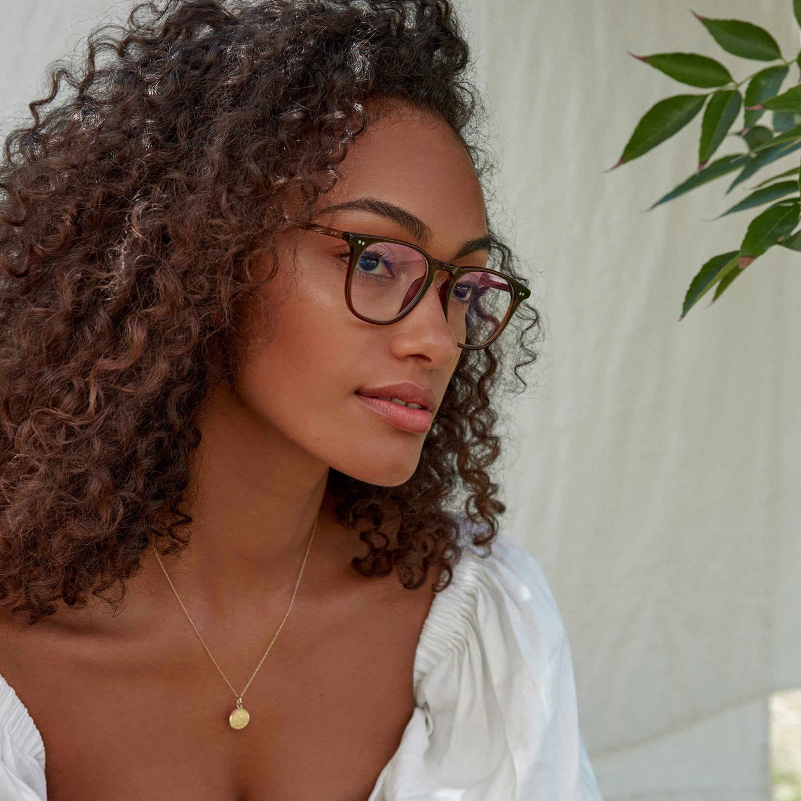 Female wearing the Maxwell Whiskey Crystal Blue Light Technology Glasses