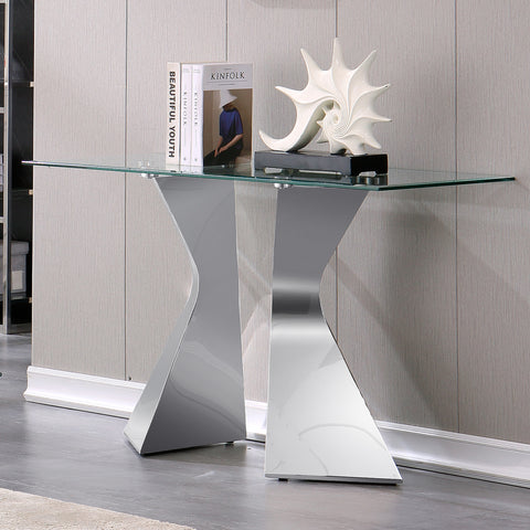 Using a Silver Console Table to Elevate Your Entryway  Introduction: In today's blog, we explore the elegance and practicality of a silver console table that is perfect for your entryway. With its clear glass top and silver metal base, this modern hallway table effortlessly combines style and functionality to enhance your home's ambiance. Let's dive in and discover how this console table can transform your entryway into a welcoming and sophisticated space.  Sleek Design and Reflective Beauty: The silver polished metal base of the console table adds a unique touch to its design. The wavy-shaped base not only creates visual interest but also brings a sense of dynamic movement to your entryway. Coupled with the clear tempered glass top, this console table creates an exquisite geometric pattern that amplifies the overall grandeur and allure of the space. The reflective nature of the glass adds a touch of sophistication, making your entryway appear brighter and more inviting.  Versatile Functionality for Different Spaces: One of the standout features of this console table is its versatility. Whether it's used as an entryway table, console table, wall table, or even a sofa table, this piece seamlessly adapts to various spaces and functions. Its sleek and modern design allows it to blend perfectly with different styles of living rooms, making it a versatile and practical addition to your home decor.  Personalize and Display: The console table serves as a valuable platform for showcasing your unique style and taste. Enhance the sense of ceremony in your entryway by adorning the table with your favorite decorative items. Whether it's a vase filled with fresh flowers, art pieces, or treasured photographs, these adornments will elevate the overall ambiance of the room, making it feel more personalized and welcoming. With the clear glass top as a backdrop, your decorations will truly stand out and capture the attention of anyone who enters your home.  Practical and Inviting: In addition to its aesthetic appeal, this console table also offers practical functionality. The clear tempered glass top provides a perfect platform for displaying your favorite decorative items. Moreover, you can also incorporate a stylish lamp or other decorative objects to further enhance the table's appearance. The silver stainless steel base, paired with the mirror-like finish, reflects light and creates a captivating visual effect that adds warmth and sophistication to your entryway. Not only will you impress your family and friends, but you will also create a welcoming and inviting space for anyone who enters your home.  Conclusion: Elevate the elegance of your entryway with a silver console table. The sleek design, reflective beauty, and versatile functionality make it a perfect addition to any home. Showcase your unique style and taste by personalizing the table with your favorite decorations. The practicality of this console table adds a touch of sophistication to your entryway, creating a warm and inviting atmosphere. Experience the transformative power of a silver console table and make a lasting impression on your guests.