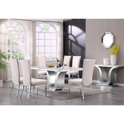 Indulge in the sheer elegance of the AUZ Furniture dining suite, where sumptuous design meets contemporary sophistication. Each chair is draped in luxurious white velvet, presenting a high, backward-curved backrest and a meticulous hand-stitched diamond pattern. These seats rest upon polished silver legs that reflect a modern aesthetic. At the center of this ensemble lies a 63.98'' pristine white tabletop, a statement of purity and grace, set on a strikingly polished metal U base with a gleaming silver finish. This compelling combination of polished stainless steels and lush upholstery invites you into a realm of unparalleled style and comfort.