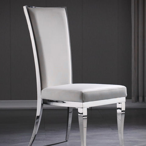 Title: Experience the Elegance of AUZ White Velvet Dining Chairs  Introduction: In today’s blog, AUZ will unveil a masterpiece of modern furniture - the White Velvet Dining Chairs. Combining high-back comfort, meticulous craftsmanship, and a touch of Mid-Century modern aesthetics, these chairs are the epitome of style and sophistication. Let’s delve into the remarkable features, with a special focus on the exquisite design of the backrest.  The Perfect Fusion of Comfort and Style: The AUZ White Velvet Dining Chairs are designed to offer not only a comfortable seating experience but also an exquisite visual appeal. The high-back design provides ample support to your spine, ensuring a comfortable posture during long hours of dining or engaging conversations.  Handcrafted Details: The backrest of these AUZ white and silver dining chairs showcases a stunning diamond pattern, meticulously hand-sewn to create a unique and visually captivating design. This intricate detailing adds a touch of elegance to the overall aesthetics, making these chairs a true centerpiece in any dining space.  Ergonomic Design for Added Support: Recognizing the importance of ergonomic design, the White Velvet Dining Chairs feature a gently reclined center in the backrest. This thoughtful contour follows the natural curvature of the human body, providing optimal support and comfort, even during extended periods of sitting.  Timeless Mid-Century Modern Appeal: Featuring clean lines and a minimalist silhouette, these chairs effortlessly blend modern aesthetics with a hint of Mid-Century charm. The combination of the sleek metal frame and the plush white velvet upholstery creates a stunning visual contrast that complements various interior styles and adds a touch of timeless elegance to your dining area.  Exquisite Color Combination: The AUZ White Velvet Dining Chairs boast a striking color combination of white and silver. The pristine white velvet upholstery exudes sophistication and a sense of luxury, while the silver polished metal legs with their unique horseshoe-shaped front and elegantly curved back legs add a contemporary flair.  Conclusion: The White Velvet Dining Chairs are a true masterpiece, showcasing the perfect synergy between comfort, style, and craftsmanship. With their high-back design, meticulous hand-sewn details, ergonomic support, and timeless aesthetics, these chairs elevate any dining space to new heights of elegance. Experience the ultimate blend of comfort and elegance with the White Velvet Dining Chairs and create unforgettable memories with your loved ones around the dining table.