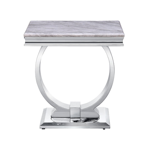 Title: The Benefits of a Silver End Table for Modern Decor  Subtitle: Enhance Your Space with a Stylish and Versatile Addition  Introduction: In modern interior design, the choice of furniture plays a crucial role in creating a sleek and contemporary atmosphere. A silver end table with a mirrored metal U-base is a versatile piece that brings elegance and functionality to any living space. Its minimalist design and silver finish make it a perfect choice for those who appreciate clean lines and a touch of glamour. In this article, we will explore the benefits of incorporating a silver end table into your modern decor.  Adding a Touch of Elegance: The silver mirrored finish of the end table adds a touch of elegance to any room. The reflective surface not only creates a visually appealing look but also enhances the perception of space. The mirrored effect adds depth and dimension, making the room feel more open and inviting. Whether placed in a living room, family room, study, or office, this end table brings a sense of sophistication and refinement to your space.  Versatile and Functional: One of the key advantages of a silver end table is its versatility. Its square shape and clean lines make it a perfect match for various design styles, including modern, contemporary, and minimalist[3]. Whether you prefer a monochromatic color scheme or want to add a metallic accent to your space, this end table seamlessly blends with different aesthetics. It serves as a functional piece, providing a convenient surface for placing drinks, books, or decorative items, while also serving as a stylish focal point.  Illuminating and Enlarging Space: The mirrored silver finish of the end table has the remarkable ability to reflect light, creating a brighter and more luminous ambiance[3]. It helps maximize the natural light in the room, making it feel more open and spacious. Additionally, the reflective surface can also enhance the appearance of other furniture and decor items in the room, making them stand out and adding a touch of luxury to the overall design.  Easy Maintenance: In addition to its aesthetic appeal, the silver end table is also practical and easy to maintain. The high gloss textured top is smooth, waterproof, and heat resistant, allowing for easy cleaning with just a damp or dry cloth. This feature ensures that the table retains its pristine appearance over time, making it a durable and long-lasting addition to your living space.  Conclusion: A silver end table with a mirrored metal U-base is a versatile and stylish choice for modern decor. Its minimalist design, reflective surface, and easy maintenance make it a valuable addition to any living room, family room, study, or office space. By incorporating this elegant piece into your interior design, you can elevate the overall aesthetic and create a sophisticated atmosphere. Embrace the beauty and functionality of a silver end table to enhance your living space with its timeless appeal and modern charm.