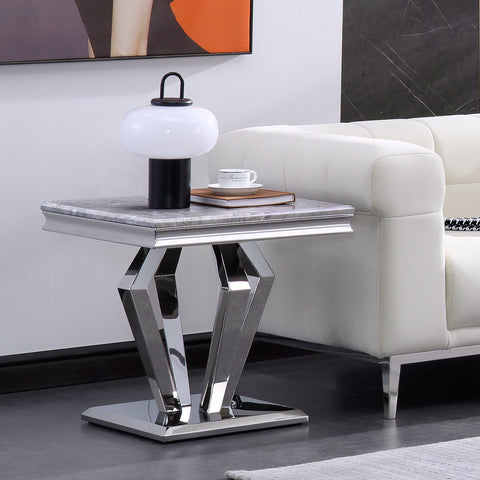 Title: Create a Glamorous and Functional Living Room with a Silver End Table  Introduction: When it comes to designing a stylish and elegant living room, every detail matters. Adding the right furniture pieces can instantly elevate the overall look and feel of the space. One such essential piece is a silver end table with a mirror geometric metal base. Combining class and functionality, this end table serves as a perfect addition to any bedroom, sofa couch, or accent table. In this blog post, we will explore the features and benefits of this sleek silver end table and how it can enhance your living room.  Classy and Elegant Design: The silver end table boasts a square shape with a grey smooth top and shiny silver legs, creating a classy and elegant look. Its mirrored metal top adds a touch of glam, reflecting and enhancing the decor items you place on it. Whether you prefer a modern or a more traditional style, this end table complements various interior design themes effortlessly.  Sturdy Structure: Durability and stability are crucial when choosing furniture. The end table's metal legs are connected with a geometric shape, ensuring maximum stability. The legs are designed to withstand heavy loads, thanks to the durable, laminate MDF board table top. This seamless fusion of durability and an eye-catching design makes it a reliable and long-lasting addition to your living room.  Easy to Care: Maintaining furniture should be hassle-free, and this silver end table delivers just that. The glossy desktop and metal base have a high-gloss finish, making it smooth, waterproof, and heat resistant. Cleaning becomes a breeze as it can be easily wiped clean with a damp or dry cloth. This convenience allows you to enjoy the end table's beauty without worrying about accidental spills or heat damage.  Functional and Versatile: Measuring 21.7" (L) x 21.7" (W) x 21.9" (H), this end table provides ample surface room for placing decorative items, reading materials, drinks, and other accessories. It serves as a practical storage solution, ensuring easy access to essential items while adding a touch of sophistication to the room. Whether you need a spot to display a vase of flowers or a convenient place for your evening tea, this end table has you covered.  Easy Assembly: No need to stress over complicated assembly processes. The silver end table comes with clear instructions, necessary hardware, and assembly tools, making installation a breeze. Within a short time, you can have this stunning piece ready to adorn your living room.  Conclusion: Elevate your living room's style with a silver end table with a mirror geometric metal base. Its sophisticated design, sturdy structure, easy maintenance, and versatile functionality make it a fantastic addition to any glam-inspired space. With this end table, you can create a foundation for a stylish and elegant living room that reflects your personal taste and adds a touch of sophistication to your home décor.