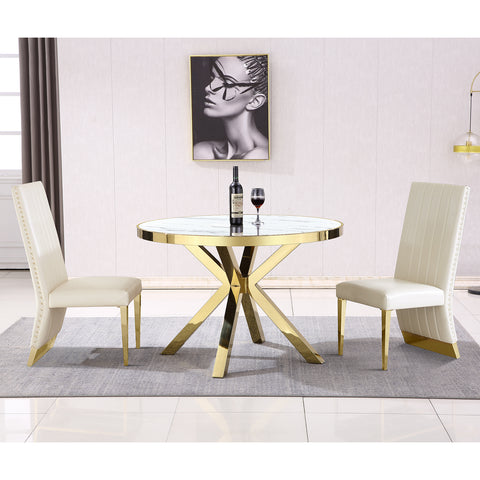 Introducing the AUZ furniture dining chair and table combination, where luxury meets elegance. The dining chair features a sleek white leather upholstery that is both timeless and sophisticated. Its high back design with channel detailing offers optimal comfort and support. The exquisite nail head trim adds a touch of refinement to the overall aesthetic. Completing the look are stunning metal gold legs that bring a glamorous touch to any dining space.  Paired with the dining chair is the round table, adorned with a high gloss white top for a chic and contemporary appeal. The gold metal X legs provide a sturdy and stylish base, while the mirror gold finish adds a touch of opulence. With its 45'' round top, this table is perfect for intimate gatherings and creates a warm and inviting atmosphere.  Together, the AUZ furniture dining chair and table combination create a luxurious and inviting dining experience. With its elegant design elements, including the nail head trim, metal gold legs, white leather upholstery, high gloss white top, gold metal X legs, and mirror gold finish, this combination is sure to elevate any dining space to new heights of sophistication and style.