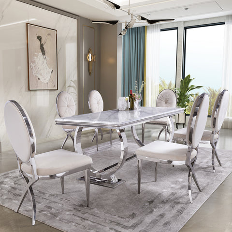 Title: Exquisite Beauty and Comfort: Embellishing Your Dining Room with Jewel-inspired Beige Velvet Chairs  Introduction: Creating a dining space that emanates elegance and comfort is a desire shared by many homeowners. The jewel-inspired Beige velvet chairs, featuring a gem-like backrest and a blossoming bud design, offer the perfect solution. This article delves into the exceptional features and design elements of these chairs, showcasing their ability to transform your dining room into a haven of refined beauty.  Embracing Gem-like Backrest: Drawing inspiration from the allure of precious gemstones, the carefully designed backrest of these chairs exudes sophistication. Resembling the curves and facets of round gemstones, the backrest tantalizes the eye with its captivating form. This thoughtful detail adds an element of allure and luxury to the dining area, creating an exquisite focal point that will certainly leave a lasting impression on guests.  Delicate Blossoming Bud: Capturing the essence of natural beauty, the chairs' backrest centers around a delicate flower bud design. Encapsulating the elegance and grace of nature, this intricate detail adds a touch of whimsy to the overall design. It creates a harmonious contrast against the gem-like backrest, further enhancing the refined aesthetics of the chairs.  Enhanced Seating Comfort: The creators of these chairs were mindful of the importance of comfort during extended dining experiences. A notable feature is the widened cushion, allowing ample space for relaxation and enjoyment. With this luxurious enhancement, you and your guests can savor delectable meals and engaging conversations without any concerns of discomfort or restlessness.  Unique Leg Design: The design concept extends to the legs of these chairs, where attention to detail truly shines. The front legs boast an elegant conical shape, adding a touch of sleekness to the overall silhouette. On the other hand, the back legs mimic the graceful curvature reminiscent of a swallow's tail or a tuxedo shape. These design choices offer a delightful contrast that emphasizes the chair's sophistication and individuality.  Beige Velvet Upholstery: To heighten the sense of opulence, these dining chairs are upholstered in a refined shade of beige within the velvet fabric family. The luxurious and soft texture of the velvet complements the serene Beige color, resulting in an exquisite combination that epitomizes elegance and comfort. The use of this premium material ensures a tantalizing tactile experience, further elevating the overall aesthetic appeal.  Dimensions and Installation: The dimensions of these upholstered dining chairs are 22"D x 20.5"W x 40.7"H, providing ample seating space without overpowering the room. Additionally, the chairs are designed for easy installation, making them a convenient choice for transforming your dining area with minimal effort.  Conclusion: By adorning your dining room with jewel-inspired Beige velvet chairs, you infuse your space with a unique blend of exquisite beauty and unparalleled comfort. The gem-like backrest, delicate blossoming bud design, wider cushion, unique leg shapes, and milky white swan velvet upholstery come together to create a dining experience that is nothing short of extraordinary. Elevate the aesthetic charm and invite an atmosphere of sophistication into your home with these captivating dining chairs.